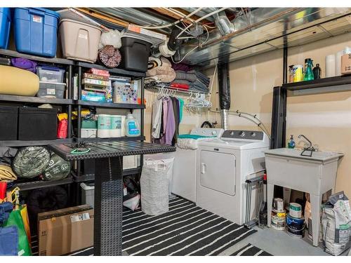 323 Toscana Gardens Nw, Calgary, AB - Indoor Photo Showing Laundry Room