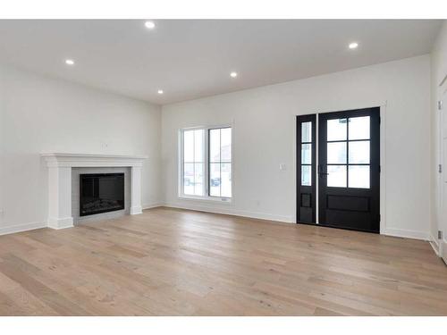 218 Red Tail Ridge Se, High River, AB - Indoor Photo Showing Living Room With Fireplace