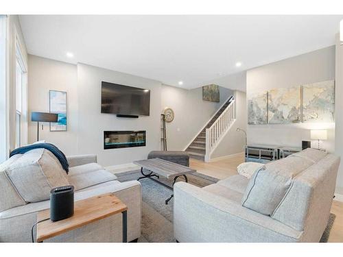 277 Ambleside Avenue Nw, Calgary, AB - Indoor Photo Showing Living Room With Fireplace