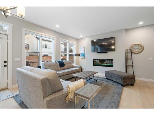 277 Ambleside Avenue Nw, Calgary, AB - Indoor Photo Showing Living Room With Fireplace