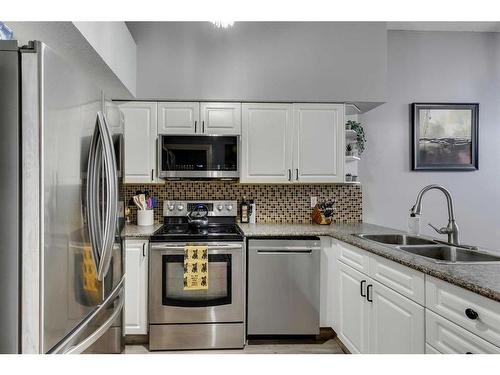 112 Chaparral Ridge Circle Se, Calgary, AB - Indoor Photo Showing Kitchen With Double Sink