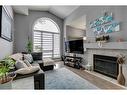 112 Chaparral Ridge Circle Se, Calgary, AB  - Indoor Photo Showing Living Room With Fireplace 