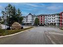 333-1 Crystal Green Lane, Okotoks, AB  - Outdoor With Balcony With Facade 