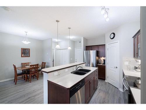 333-1 Crystal Green Lane, Okotoks, AB - Indoor Photo Showing Kitchen With Double Sink