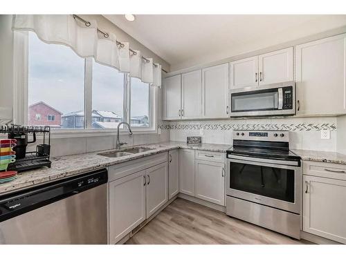 68 Evanscrest Place Nw, Calgary, AB - Indoor Photo Showing Kitchen With Stainless Steel Kitchen With Double Sink