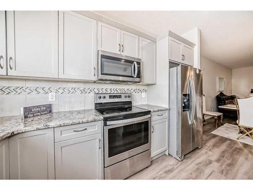 68 Evanscrest Place Nw, Calgary, AB - Indoor Photo Showing Kitchen With Stainless Steel Kitchen With Upgraded Kitchen