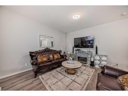 68 Evanscrest Place Nw, Calgary, AB - Indoor Photo Showing Living Room With Fireplace