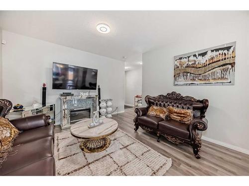 68 Evanscrest Place Nw, Calgary, AB - Indoor Photo Showing Living Room With Fireplace