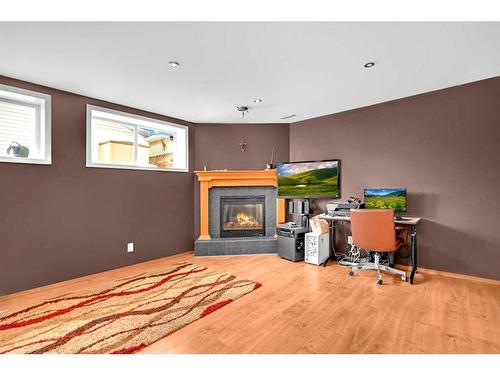 102 Cranberry Square Se, Calgary, AB - Indoor With Fireplace