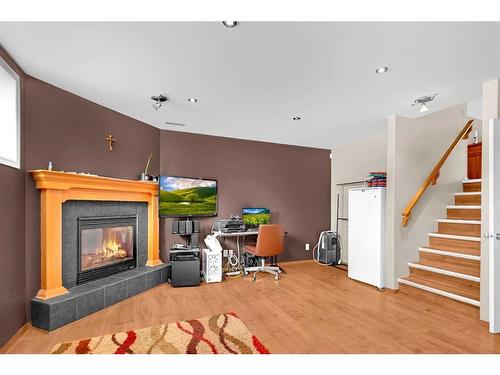 102 Cranberry Square Se, Calgary, AB - Indoor With Fireplace