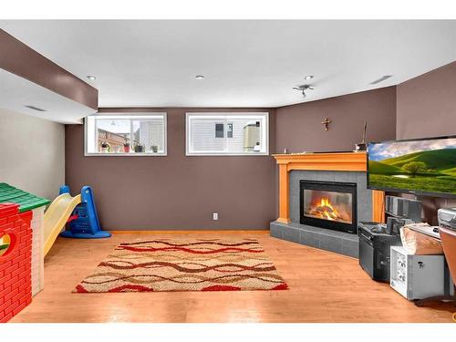 102 Cranberry Square Se, Calgary, AB - Indoor With Fireplace