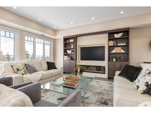 2467-2330 Fish Creek Boulevard Sw, Calgary, AB - Indoor Photo Showing Living Room With Fireplace