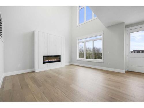 6 Fireside Point, Cochrane, AB - Indoor Photo Showing Living Room With Fireplace