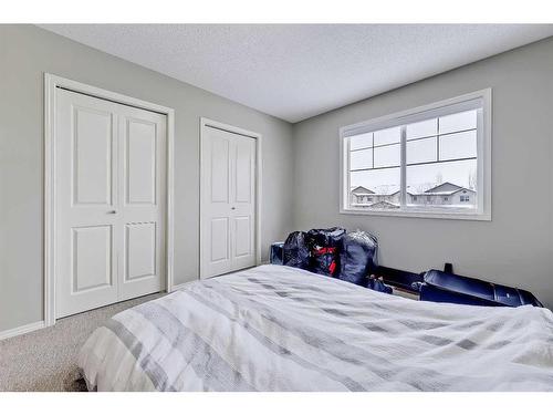 75-105 Drake Landing Common, Okotoks, AB - Indoor Photo Showing Bedroom