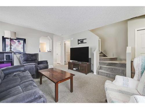 75-105 Drake Landing Common, Okotoks, AB - Indoor Photo Showing Living Room