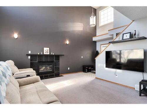 20 Douglas Glen Crescent Se, Calgary, AB - Indoor Photo Showing Living Room With Fireplace