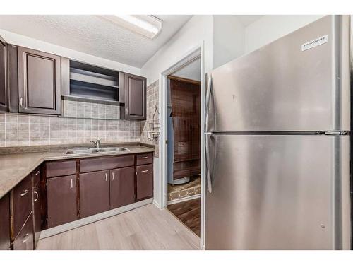 512-3500 Varsity Drive Nw, Calgary, AB - Indoor Photo Showing Kitchen With Double Sink