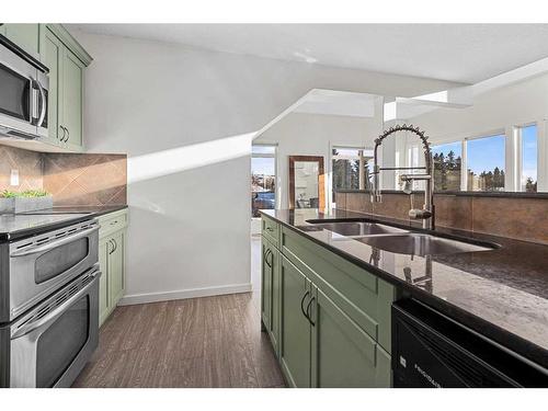 305-141 Mountain Street, Cochrane, AB - Indoor Photo Showing Kitchen With Double Sink