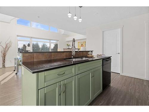 305-141 Mountain Street, Cochrane, AB - Indoor Photo Showing Kitchen With Double Sink