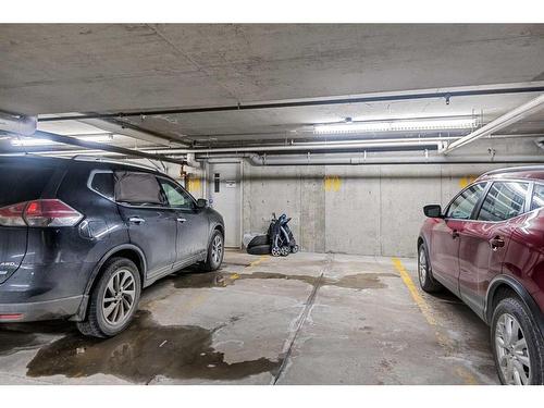 305-141 Mountain Street, Cochrane, AB - Indoor Photo Showing Garage