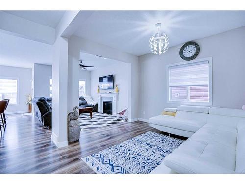 126 Saddlestone Park Ne, Calgary, AB - Indoor Photo Showing Living Room With Fireplace