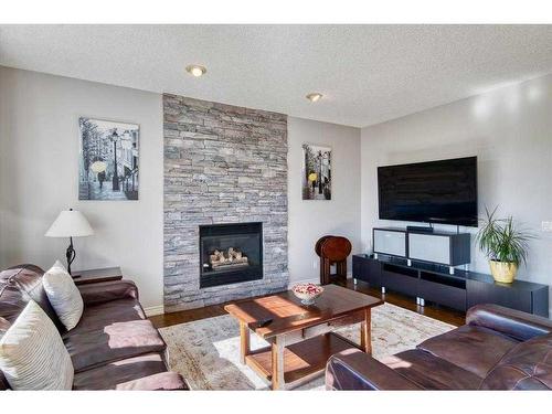 12 Hidden Creek Drive Nw, Calgary, AB - Indoor Photo Showing Living Room With Fireplace