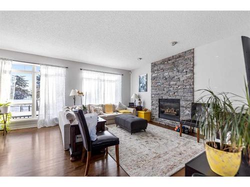 12 Hidden Creek Drive Nw, Calgary, AB - Indoor Photo Showing Living Room With Fireplace