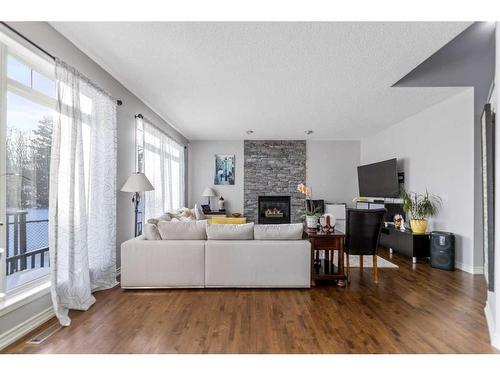 12 Hidden Creek Drive Nw, Calgary, AB - Indoor Photo Showing Living Room With Fireplace