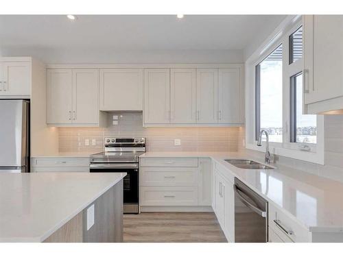 303-85 Sage Hill Heights, Calgary, AB - Indoor Photo Showing Kitchen With Stainless Steel Kitchen With Double Sink