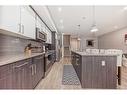 1-1714 Kensington Road Nw, Calgary, AB  - Indoor Photo Showing Kitchen With Upgraded Kitchen 