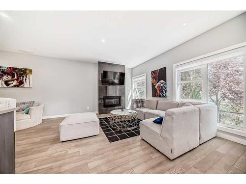 1-1714 Kensington Road Nw, Calgary, AB - Indoor Photo Showing Living Room With Fireplace