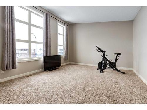 140 Walden Rise Se, Calgary, AB - Indoor Photo Showing Gym Room