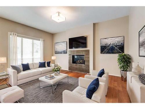 140 Walden Rise Se, Calgary, AB - Indoor Photo Showing Living Room With Fireplace