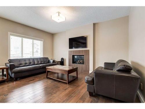 140 Walden Rise Se, Calgary, AB - Indoor Photo Showing Living Room With Fireplace