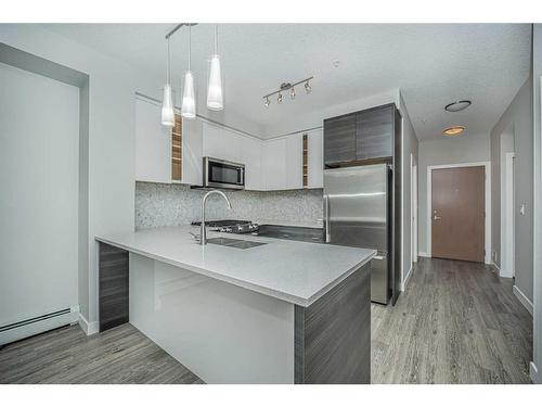 3113-95 Burma Star Road Sw, Calgary, AB - Indoor Photo Showing Kitchen With Stainless Steel Kitchen With Double Sink