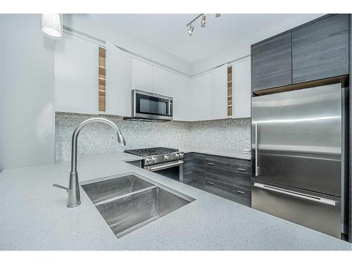 3113-95 Burma Star Road Sw, Calgary, AB - Indoor Photo Showing Kitchen With Stainless Steel Kitchen With Double Sink With Upgraded Kitchen