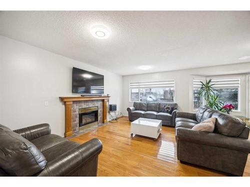 646 Sierra Morena Court Sw, Calgary, AB - Indoor Photo Showing Living Room With Fireplace