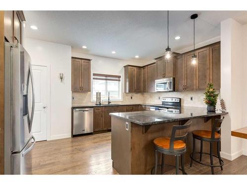 200 Heartland Way, Cochrane, AB - Indoor Photo Showing Kitchen With Stainless Steel Kitchen