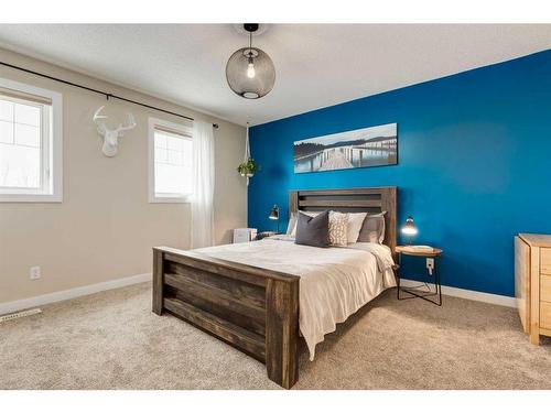 200 Heartland Way, Cochrane, AB - Indoor Photo Showing Bedroom