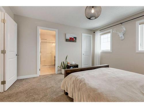 200 Heartland Way, Cochrane, AB - Indoor Photo Showing Bedroom