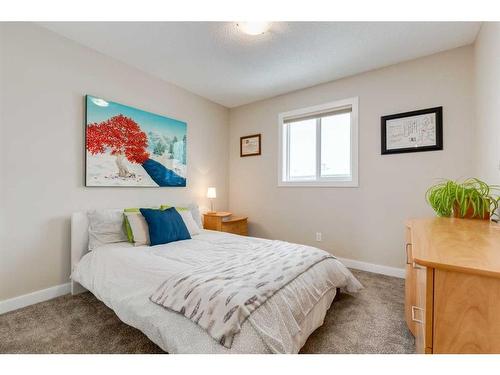 200 Heartland Way, Cochrane, AB - Indoor Photo Showing Bedroom