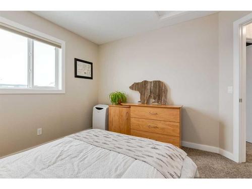 200 Heartland Way, Cochrane, AB - Indoor Photo Showing Bedroom