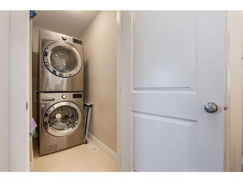 200 Heartland Way, Cochrane, AB - Indoor Photo Showing Laundry Room