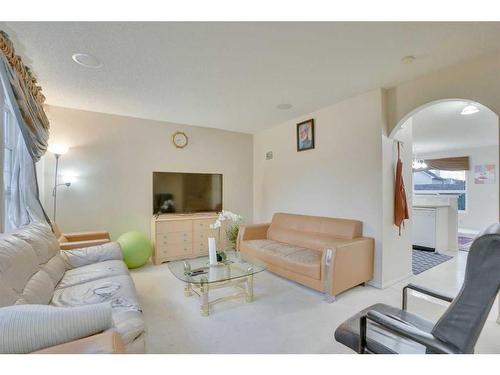 81 Taravista Way Ne, Calgary, AB - Indoor Photo Showing Living Room