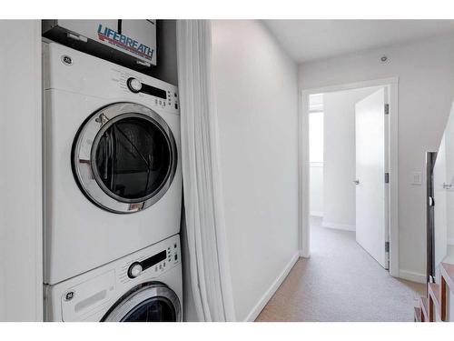 210-116 7A Street Ne, Calgary, AB - Indoor Photo Showing Laundry Room