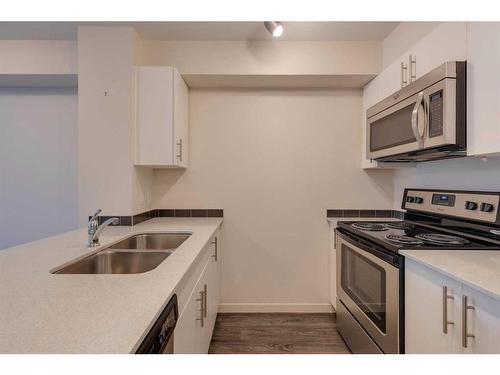 4208-181 Skyview Ranch Manor Ne, Calgary, AB - Indoor Photo Showing Kitchen With Double Sink