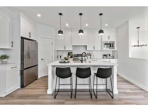 48 Drake Landing Square, Okotoks, AB - Indoor Photo Showing Kitchen With Stainless Steel Kitchen With Upgraded Kitchen