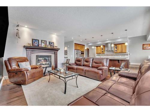 50 Sage Hill Way Nw, Calgary, AB - Indoor Photo Showing Living Room With Fireplace