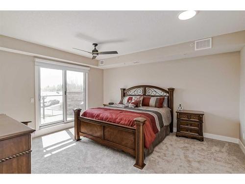 409-15 Cougar Ridge Landing Sw, Calgary, AB - Indoor Photo Showing Bedroom