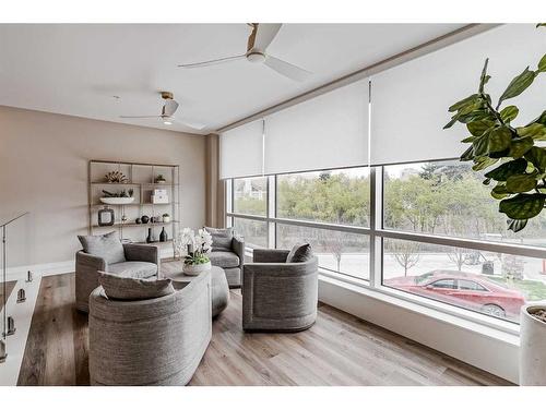 409-15 Cougar Ridge Landing Sw, Calgary, AB - Indoor Photo Showing Living Room